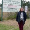 Auntie Glenda Chalker at Belgenny Farm entrance sign